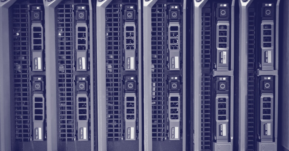 Close-up of blue-lit server drive bays in a data center rack