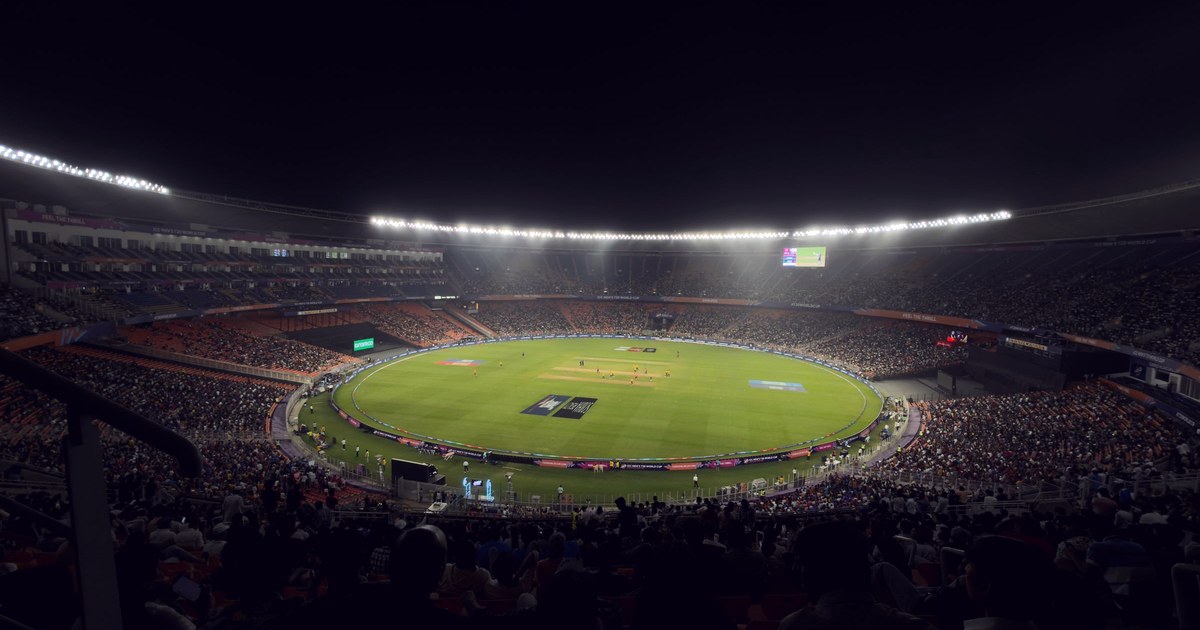 A packed, floodlit Narendra Modi Stadium in India during a night cricket match