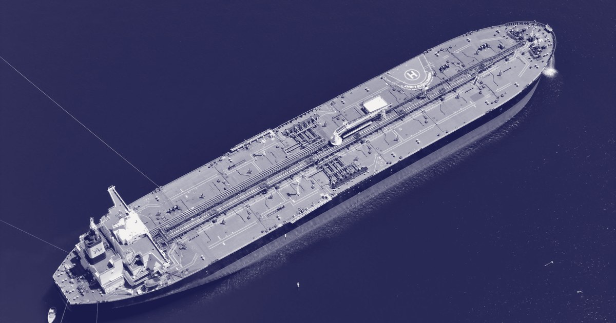 Aerial view of a crude oil tanker at sea, its green deck marked with a helipad