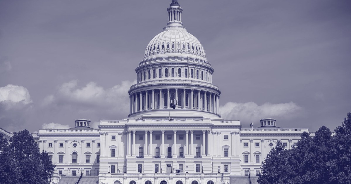 The dome of the United States Capitol building in Washington, D.C., photographed from the west lawn against a blue sky