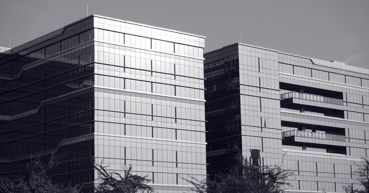 Black and white photo of modern glass office towers in Bengaluru, India