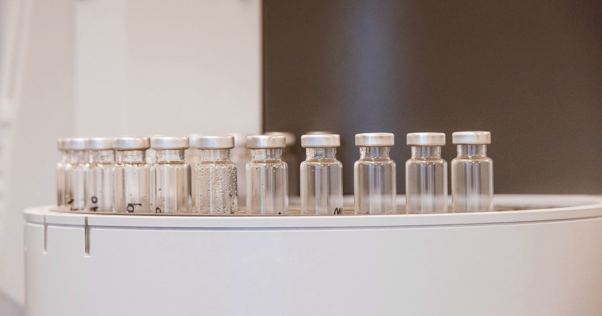 Rows of sealed glass vials on a laboratory tray, the kind used to store antivenom and other injectable medicines