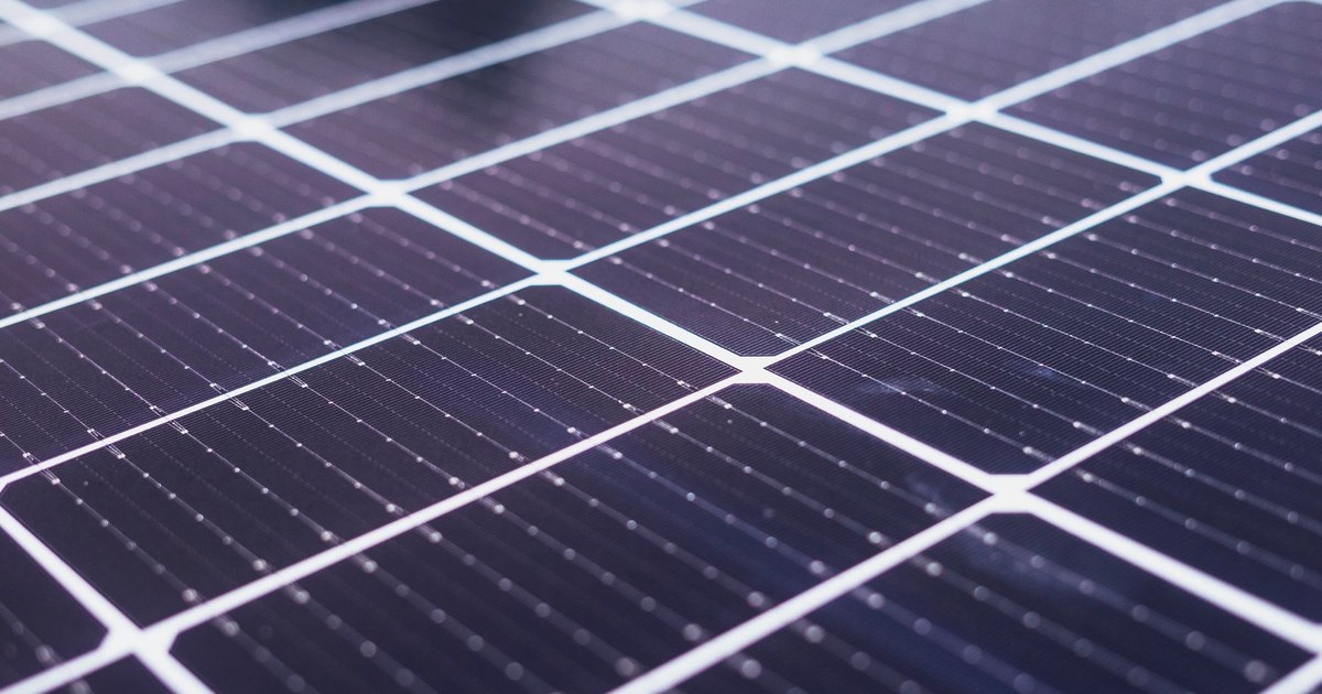 Close-up of a solar panel showing the grid of individual photovoltaic cells