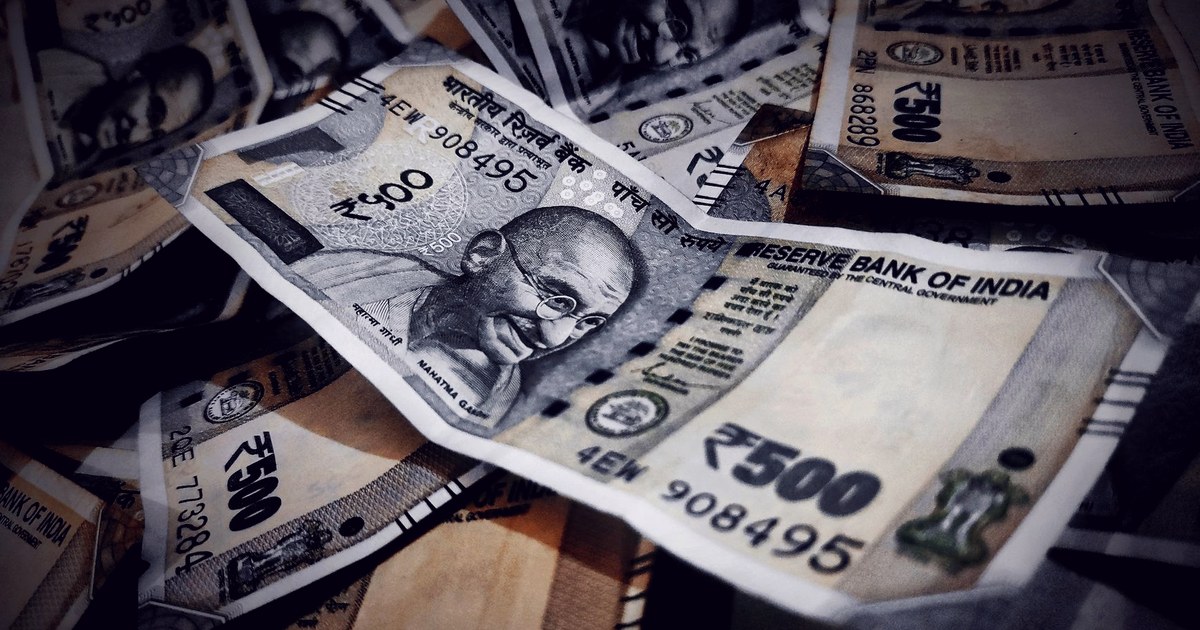 A close-up pile of Indian Rs 500 currency notes bearing the Reserve Bank of India seal and Mahatma Gandhi's portrait